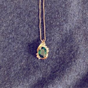 Sterling silver and 10k gold necklace and pendant with emerald stone